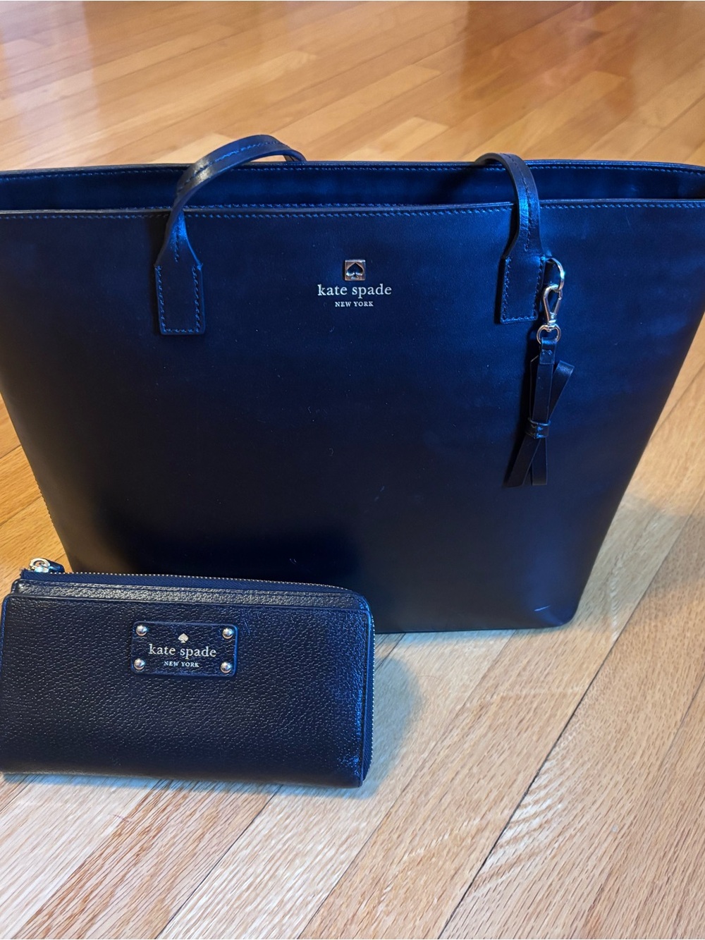 kate spade black leather tote with matching black zip wallet and tassel